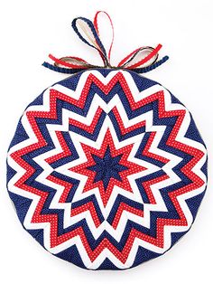 a red, white and blue ornament hanging from a string