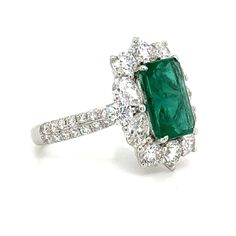 Unleash the vibrant beauty of this 5.12carat emerald and diamond statement ring! With its stunning emerald center stone and sparkling diamond accents, this ring exudes elegance and sophistication. Make a bold statement and add a touch of luxury to any outfit. Perfect for any special occasion or as an exquisite gift for your loved one! Metal: 18K White GoldDiamond Weight : 4 Pear-cut 0.79ct tw, 8 Round-cuts 1.22ct tw, 56 Round 0.48ct twNatural Earth-mined Emerald Weight: 2.63caratWidth: 16mm x 19 Large Wedding Rings, Van Cleef And Arpels Jewelry, Diamond Initial Necklace, Van Cleef & Arpels, Engagement Ring Inspiration, Statement Rings Diamond, Trending Engagement Rings, Buying An Engagement Ring, Ring Trends