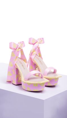 These tie-up, bow-back block heels are handcrafted with soft pastel satins in shades of pale yellow and Sakura pink. It features a dramatic square toe on an exaggerated platform that balances on our signature PAPA print . The heel is emblazoned in our gold PAPA logo band-aid. Color: Pac street girls' print- Light pink No. pieces in a set: 2 Delivery Time: 4 weeks Papa Don't Preach, Pink Block Heels, Pink Platform Heels, Street Girl, Indian Bridal Wear, Heels Online, Pu Heels, Bow Back, Pink Design