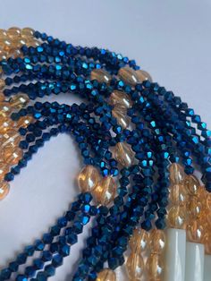 Double Strand Waist Bead "Koffikro" features two strands adorned with rich, deep blue glass seed beads. Dive into the enchanting allure of this accessory, designed to add a touch of sophistication and mystery to your style. 🌌 Blue : Immerse yourself in the deep and luxurious shades of blue that adorn each strand of this waist bead. The profound color symbolizes tranquility and depth, making it a perfect choice for expressing your inner calm and timeless elegance. 🌟 Double Strand: The double strand design adds a layer of opulence and texture, creating a visually stunning and intricate accessory. The strands cascade gracefully, allowing you to make a bold and refined statement with every movement. 🔵 Versatile Expression: Whether worn under clothing for a discreet touch or as a visible sta Strong Hand, Under Clothing, In The Deep, Color Complement, Timeless Gifts, Beads Handmade, Ivory Coast, Glass Seed Beads, Blue Beads