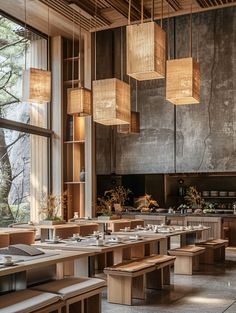 a restaurant with wooden tables and benches in front of large windows