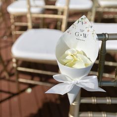 a bouquet of flowers sitting on top of a white chair