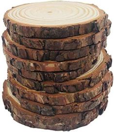 a stack of logs stacked on top of each other with wood slices in the middle