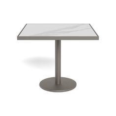 a square table with a white marble top and silver metal base on an isolated white background