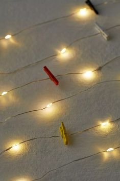 some lights that are on the ground and one is red, white and blue with yellow pins