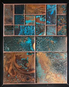 some blue and brown tiles in a black frame