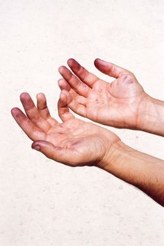 two hands reaching out towards each other