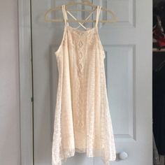 New With Tags! I Purchased This From Another Posher And It Doesn't Fit As I Want It To. The Dress Is Beautiful With Detailed Off White Lace And Croquet. Crossed Spaghetti Straps. Higher On The Sides Than Middle At The Bottom Hem. Built In Slip As Seen. Feel Free To Make An Offer Or Ask Any Questions! Measurements: About 33.5 In Length (Top Of Strap To Bottom) Armpit To Bottom Is 22in Delicate, Vintage Look, Layer, Summer, Beach, Boho, Bohemian, Hippie, Coachella, Woodstock Crochet Lace Dress For Day Out, Sleeveless Beige Dress With Crochet Lace, Lace Crochet Trim Sundress, Cream Lace Crochet Dress For Spring, Lace Crochet Sundress With Crochet Trim, Spring Cream Lace Crochet Dress, Casual Summer Lace Crochet Dress, Summer Lace Mini Dress With Crochet Trim, Beach Mini Dress In Beige Lace