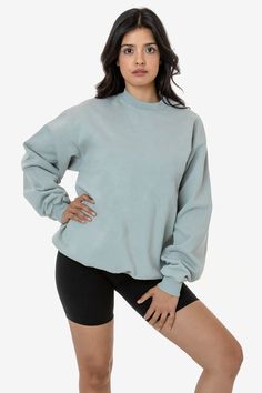 Made from a luxurious 14oz fleece, this crewneck is incredibly soft and warm, yet still breathable and moisture-wicking. The loose fit allows for a full range of motion, making it perfect for everything from running errands to lounging around the house. The ribbed cuffs and hem keep the cold out. This crewneck is Garment Dyed. Our garment-dyed crewneck sweaters are dyed after they're sewn, which gives them a more durable and even color, including in the stitching and ribbing. This also means they'll have less shrinkage and colors will stay true after repeated washings. Features:  Made from our premium 14oz heavyweight fleece to keep you warm Essential crewneck styling perfect for all occasions Loose fit for a full range of motion Ribbed cuffs and hem to keep the cold out  Knitted, cut, sew Los Angeles Apparel, Garment Manufacturing, South Central, Garment Industry, Perfect Wardrobe, Off White Color, Off Black, Construction Materials, Crewneck Sweater