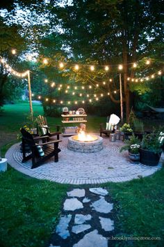 an outdoor fire pit surrounded by lawn furniture and string lights is featured in this post