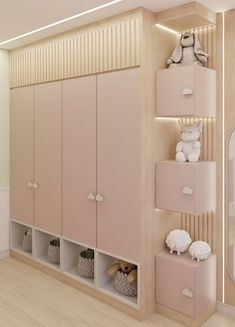 there is a room with pink cabinets and stuffed animals on the shelves next to it