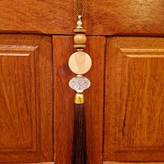 a tassel hanging from the side of a wooden door