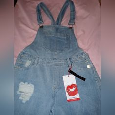 Light Blue Hot Kiss Washed Distress Denim Overalls Size 5 Cropped Frayed Wide Leg Silver Hardware With Logo 24" Inseam 33" Waist To Ankle Ripped Blue Denim Jumpsuit For Spring, Blue Ripped Denim Jumpsuit For Spring, Trendy Ripped Denim Jumpsuit, Trendy Ripped Blue Denim Jumpsuit, Trendy Blue Distressed Denim Jumpsuit, Ripped Denim Blue Jumpsuit, Distressed Denim Blue Overalls, Distressed Blue Overalls, Spring Distressed Medium Wash Shortalls