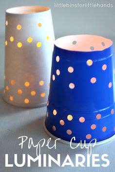 paper cup luminaries are sitting on a table with polka dot lights in them