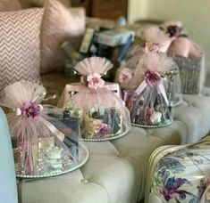 small baskets filled with items sitting on top of a couch