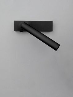 a black object is hanging on the wall