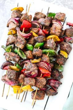 meat kebabs on skewers with peppers and onions