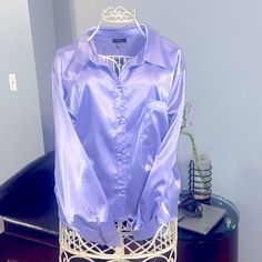 New With Tags Attached Satin Like Button Up Shirt. Sleeves Have 2 Bottoms As Well. Front Left Pocket On Shirt All Button Closure 97% Polyester 3% Spandex Fabric Snag On The Top Back Area Of The Shirt .(Pictured) Classic Purple Blouse With Button Closure, Purple Button-up Blouse For Formal Occasions, Cheap Purple Button-up Tops, Fitted Purple Button-up Blouse, Purple Button-up Blouse For Daywear, Purple Button-up Daywear Shirt, Purple Relaxed Fit Button-up Blouse, Purple Cotton Button-up Dress Shirt, Floral Bodysuit