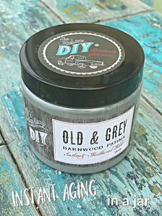 an old and grey tin sitting on top of a blue wooden table with the words diy written in it