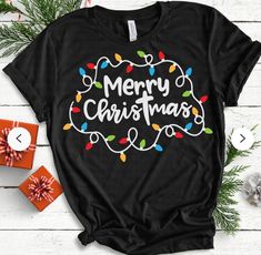 a t - shirt that says merry christmas with lights on it