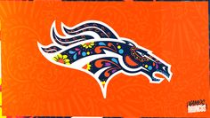 the denver cowboys logo is painted on an orange and blue background with floral designs in bright colors