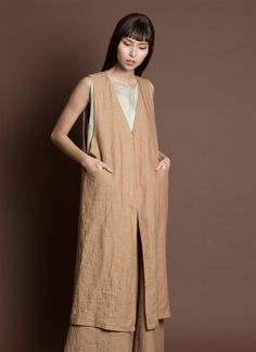 KAAREM - Sarga V-Neck Long Vest Jacket in Brown Sand Beige V-neck Vest With Pockets, Open Front Vest For Layering, Sleeveless Linen Outerwear For Fall, Sleeveless Linen Outerwear For Spring, Long Vest Jacket, Brown Sand, Blind Stitch, Long Vest, Long Vests