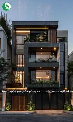 an apartment building with many balconies and plants on the balconys at night