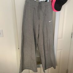 Never Before Work Nike Sweats Size Medium New With Tags Nike Full-length Bottoms With Pockets, Nike Long Bottoms With Pockets, Nike Relaxed Fit Full Length Bottoms, Nike Full Length Cotton Bottoms, Nike Full-length Cotton Bottoms, Nike Fitted Bottoms For Loungewear, Nike Stretch Casual Pants, Casual Stretch Nike Pants, Full Length Cotton Nike Bottoms