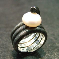 Coils of sterling silver are blackened and textured for a modern, artsy feel, topped with a large, freshwater, button pearl. So cool - it's definitely a conversation piece! Size 7 *cannot be resized* Wearables Design, Pearl Ring, Coils, Conversation Piece, Custom Jewelry, Sterling Silver Rings, Jewelry Collection, Pearl Earrings, Ready To Wear