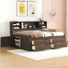 a bed with two drawers underneath it in a room