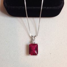 "Beautiful Ruby & White Sapphire Pendant Necklace * 3ct Emerald Cut Ruby measures 9mm x 7mm * Brilliant Cut White Sapphires * Solid Sterling Silver Setting * 18\" Sterling Silver Chain Included Hallmarked & Gift Ready! These Stones are Laboratory Grown. They are identical to the Natural Stone in every way including Chemistry, Composition and Hardness with excellent clarity & color refraction TIMELESS, BEAUTIFUL & UNIQUE FINE ART JEWELRY" Classic Necklace With Lab-created Ruby, Classic Necklace With Lab-created Ruby Gemstone, Classic Style Necklaces With Lab-created Ruby Gemstone, Classic Necklaces With Lab-created Ruby Gemstone, Silver Necklace With Gemstone And Lab-created Ruby, Silver Necklace With Lab-created Ruby Gemstone, White Gold Necklace With Lab-created Ruby Gemstone, Silver Ruby Necklace With Prong Setting, Gift Necklace With Prong Setting And Lab-created Ruby