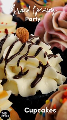 cupcakes with white frosting and chocolate drizzled on each one