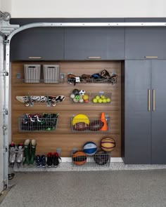 a garage filled with lots of different types of items and storage bins on the wall