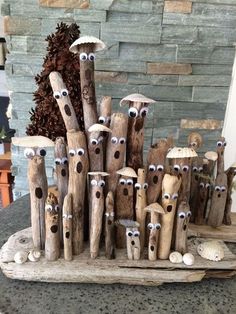 a group of wooden sticks with eyes painted on them