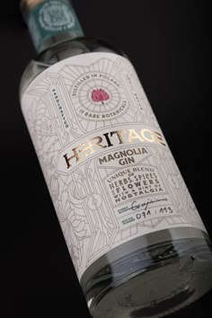 a bottle of heftage gin on a black background with the label removed from it