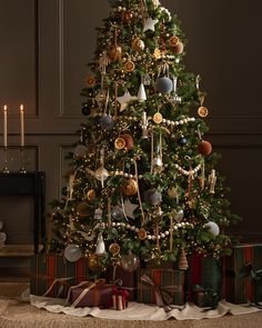 a decorated christmas tree with presents under it