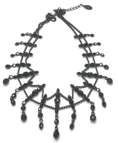 This pretty vintage Liz Claiborne choker features a double row of of faceted black beads and black chains that dangle at the ends.  The necklace measures 15" including the 4" extender chain  x 1.75" at the center and has a lobster claw clasp and is in very good excellent vintage condition.  Signed on a Hang Tag LC for Liz Claiborne and weighs 15 grams Shipping prices vary on the weight of item. I do my best to keep shipping costs reasonable. The prices quoted are not trackable and is the least e Vintage Liz Claiborne, Black Chain, Choker Necklaces, Chain Choker, Hang Tags, Faceted Bead, Black Glass, Chain Pendants, Black Beads