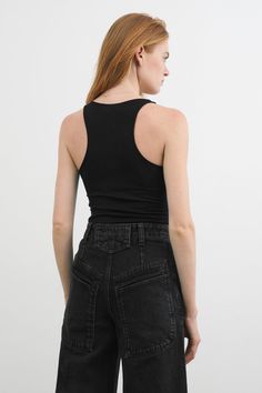 Introducing the Bowery Tank, our beautifully refined racerback design. Crafted from soft, high-stretch and sustainable European jersey, she's the wardrobe staple that blends comfort and conscientious style. Wear her solo or as a layering piece throughout the seasons – she's an outfit building block. [SPLIT] Emmy, in black, is 5'10.5" (179 cm), wearing size XS. Maritza, in off white and in pale yellow, is 5'9" (177 cm) tall, wearing size XS. Total length is approximately 23" (58.5 cm). Sustainabl Black Cotton Sportswear Tank Top, Solid Compressive Tank Top Functional, Compressive Black Sporty Tank Top, Versatile 4-way Stretch Tank Activewear, Compressive Black Sportswear Tank Top, Tank Outfit, Shes Perfect, Sweatshirt Fabric, Pale Yellow