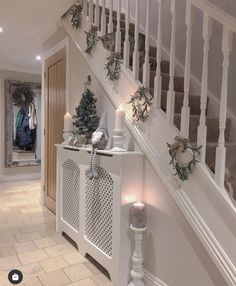 a staircase decorated with christmas decorations and candles