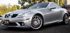 a silver sports car parked in a parking lot