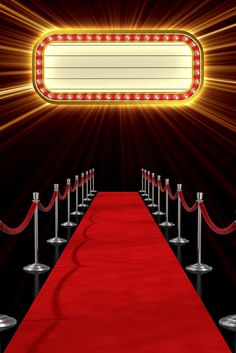 a red carpet is lined up in front of a large sign with lights on it