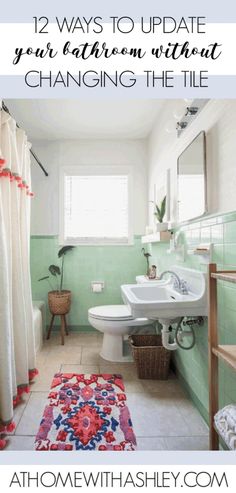 a bathroom with green walls and white fixtures, including a rug on the floor in front of the sink