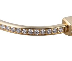 A Tiffany & Co. 18 karat yellow gold bangle set with 4.99ctw of G-H/VS diamonds. Current Retail: $40,000, comes with original box. DESIGNER: Tiffany & Co MATERIAL: 18k Yellow Gold GEMSTONES: Diamond DIMENSIONS: Bracelet fits a 6.25" wrist. MARKED/TESTED: Tiffany & Co, Au750, 4.99ct. Serial Number. WEIGHT: 52.1 grams CONDITION: Previously Owned / Excellent Condition Tiffany Bangles Gold, Gold Bracelet Tiffany & Co., Tiffany And Co Lock Bracelet, Gold Bangle Bracelet For Women Tiffany & Co., Gold Bracelet Cuff Tiffany & Co., Tiffany Lock Bangle, Diamond Bangle Bracelet, Gold Bangle Set, Yellow Gold Bangle