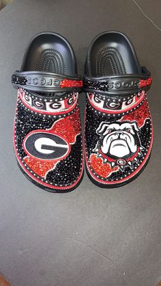 Customized Crocs by Majorbandscharms. Made to order. Croc Business, Georgia Bulldog Shoes, Croc Ideas, Taylor Swift Shoes, Water Boots, Custom Crocs, Crocs Fashion, Rhinestone Projects, Walk In My Shoes