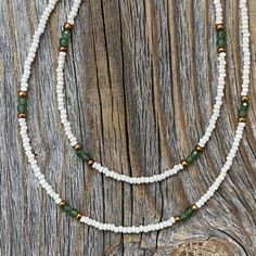 Tiny Dainty Double Strand Beaded Necklace with Jade and White Czech Glass Beads. Super Lightweight! Beads: * White Czech Glass - 1mm * Faceted Jade Beads - 2mm * Copper Spacer Beads - 2mm Clasp: *Copper Lobster Claw Clasp * The model in the pictures is wearing 16 & 18 inches. Choose your Lengths at Checkout! If you don't see a certain length in the drop down menu, please message me with the lengths you would like :) To view more of my original jewelry designs, visit: https://www.etsy.com/sho White Spiritual Necklace With Tiny Beads, Spiritual White Necklaces With Tiny Beads, White Double Strand Beaded Necklace With Colorful Beads, White Double Strand Necklace With Colorful Beads, White Double Strand Beaded Necklace, White Double Strand Bohemian Necklace, Bohemian White Double Strand Necklace, White Bohemian Double Strand Necklace, Handmade White Double Strand Beaded Necklaces