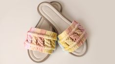 a pair of white slippers with multicolored ruffles