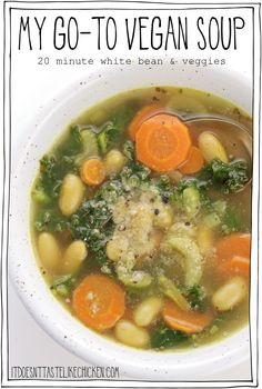 a bowl of soup with carrots, broccoli and cauliflower in it