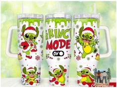 three christmas themed tumblers with the words grin mode on them and an image of cartoon characters