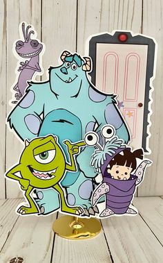 the monsters are standing next to each other in front of a door with an open sign