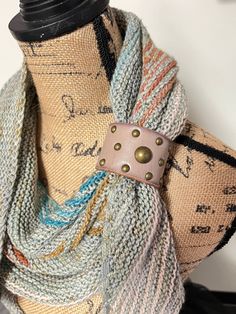 A worn out belt that has been repurposed into a shawl cuff to help hold those knit and crochet shawls or scarves in place! This listing is for ONE cuff.  Each cuff is unique! Cuffs are made from worn out belts and have blemishes and distressed marks. All cuffs are sold as pictured (keep in mind, pictures may look different on screens/monitors than they will in person). Be sure to read my announcements! Find out what I'm up to these days on Instagram: Abigailknits Leather Scarf Cuff Diy, Leather Shawl Cuffs, Silk Scarf Upcycle, Vintage Shawl Scarf, Shawl Cuff, Mind Pictures, Scarf Cuff, Hand-wrapped Wearable Art Cuff Bracelet, Scarf Holder